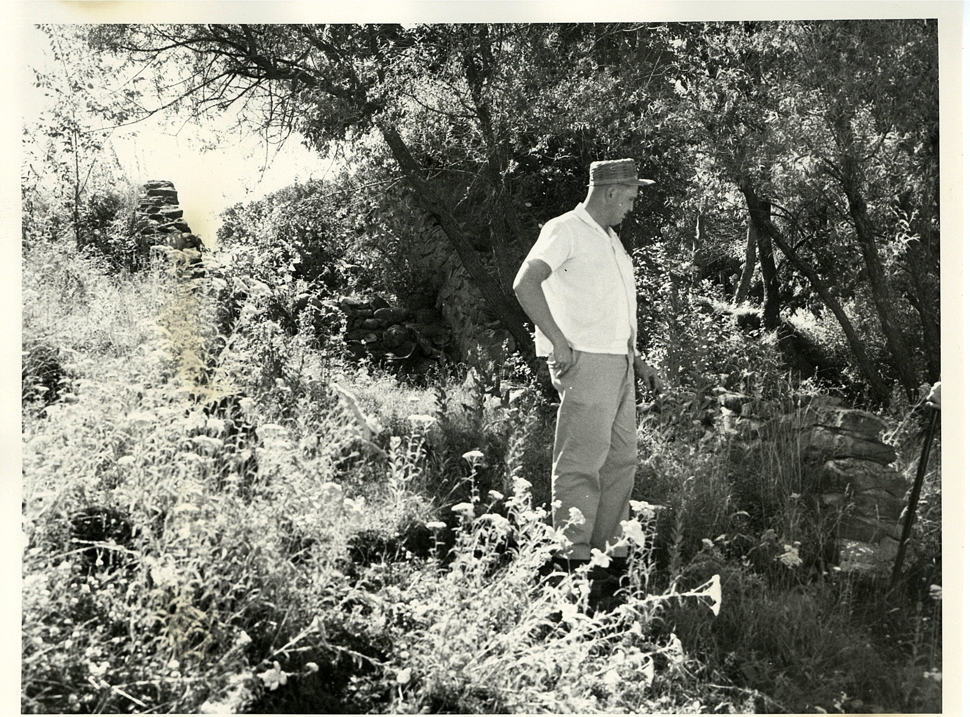 Man near a rock wall