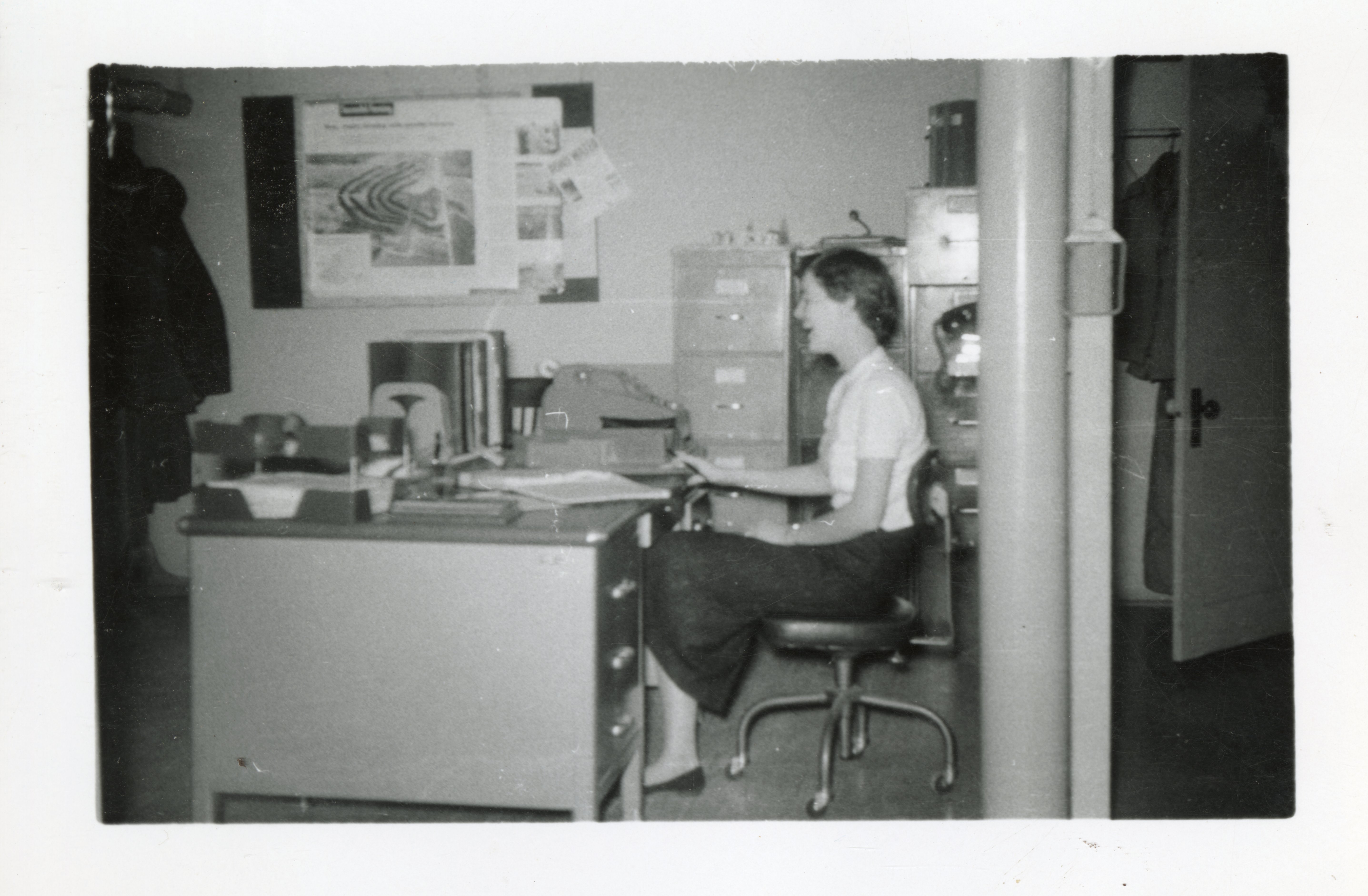 Side View of Woman at Office Desk