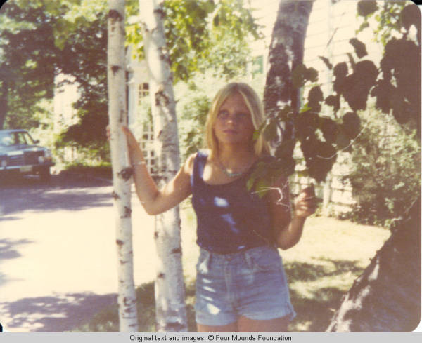 Liz standing in the trees