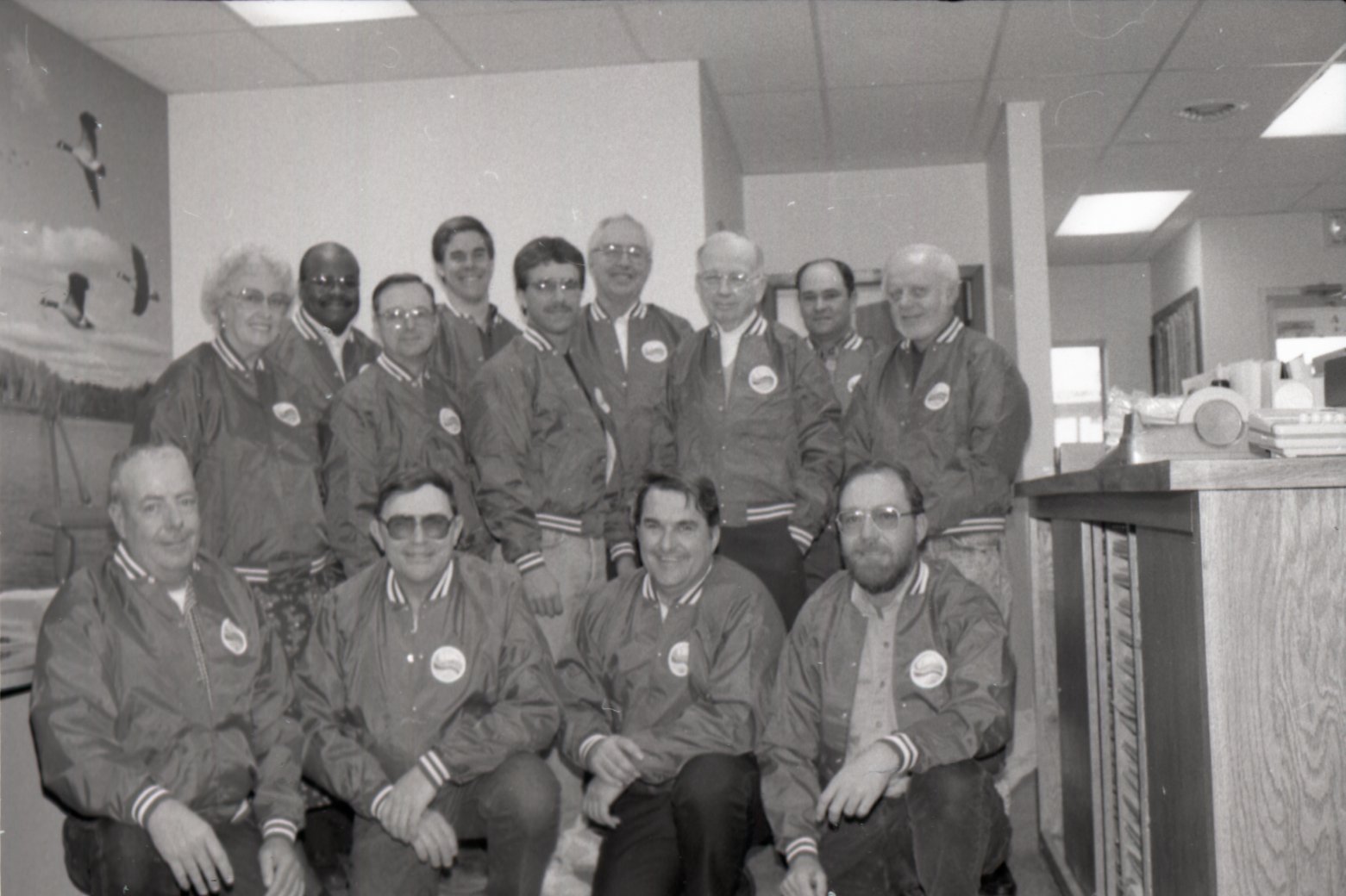 1994 Office staff  wearing matching jackets