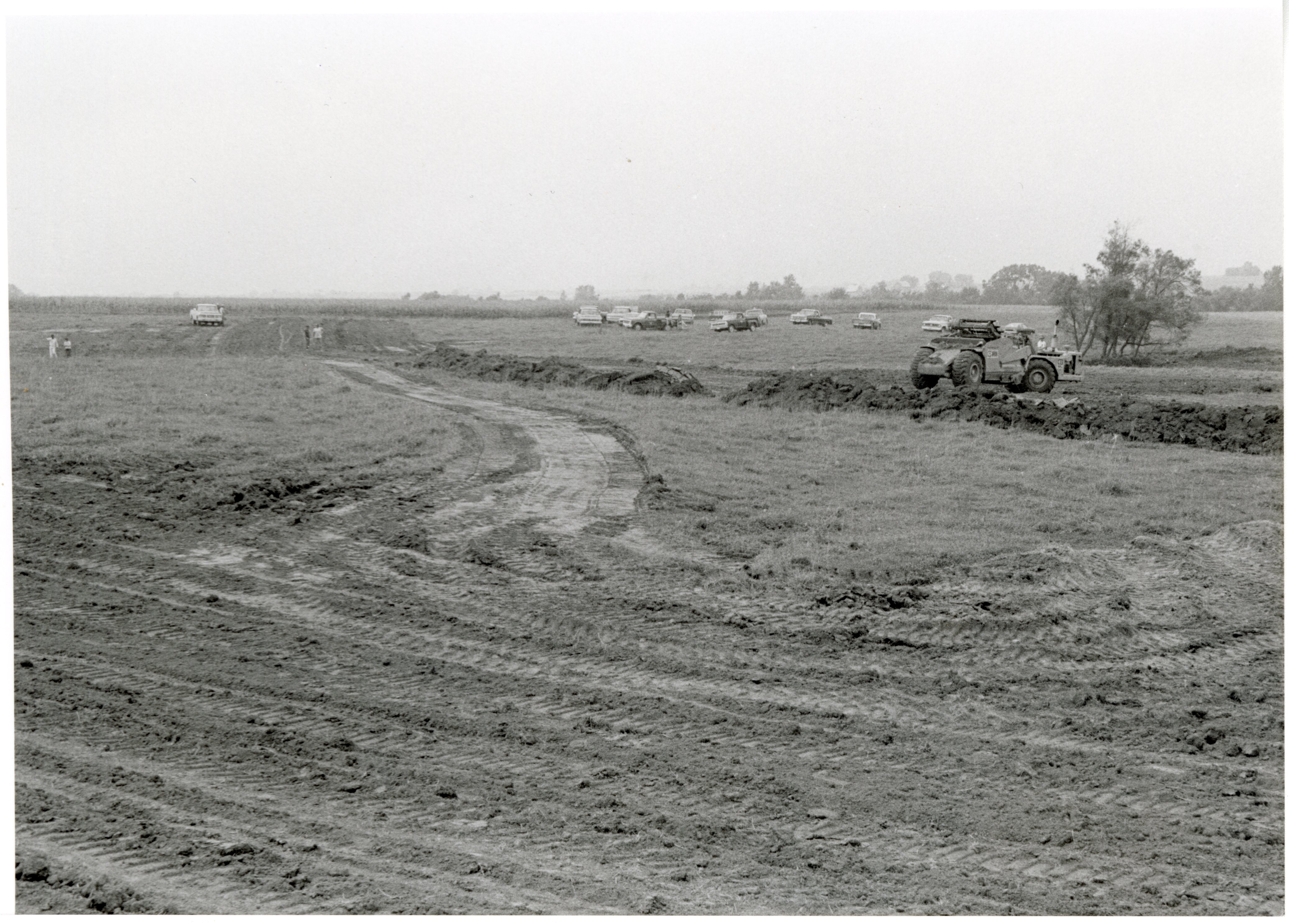 1979  field with cars in background