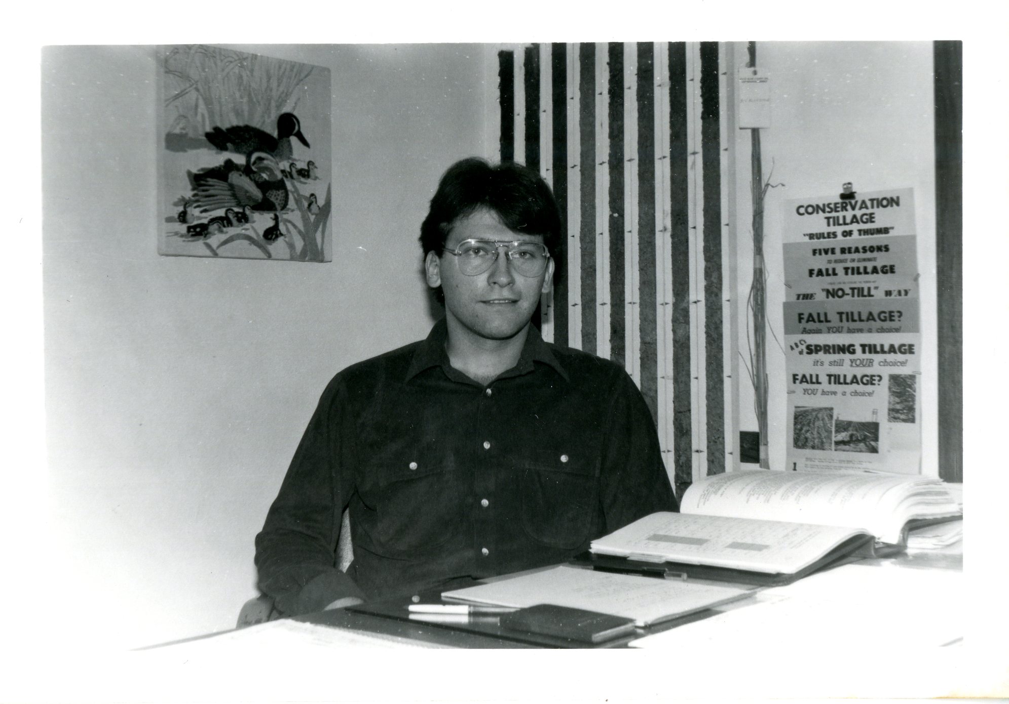 Man Seated at his Desk