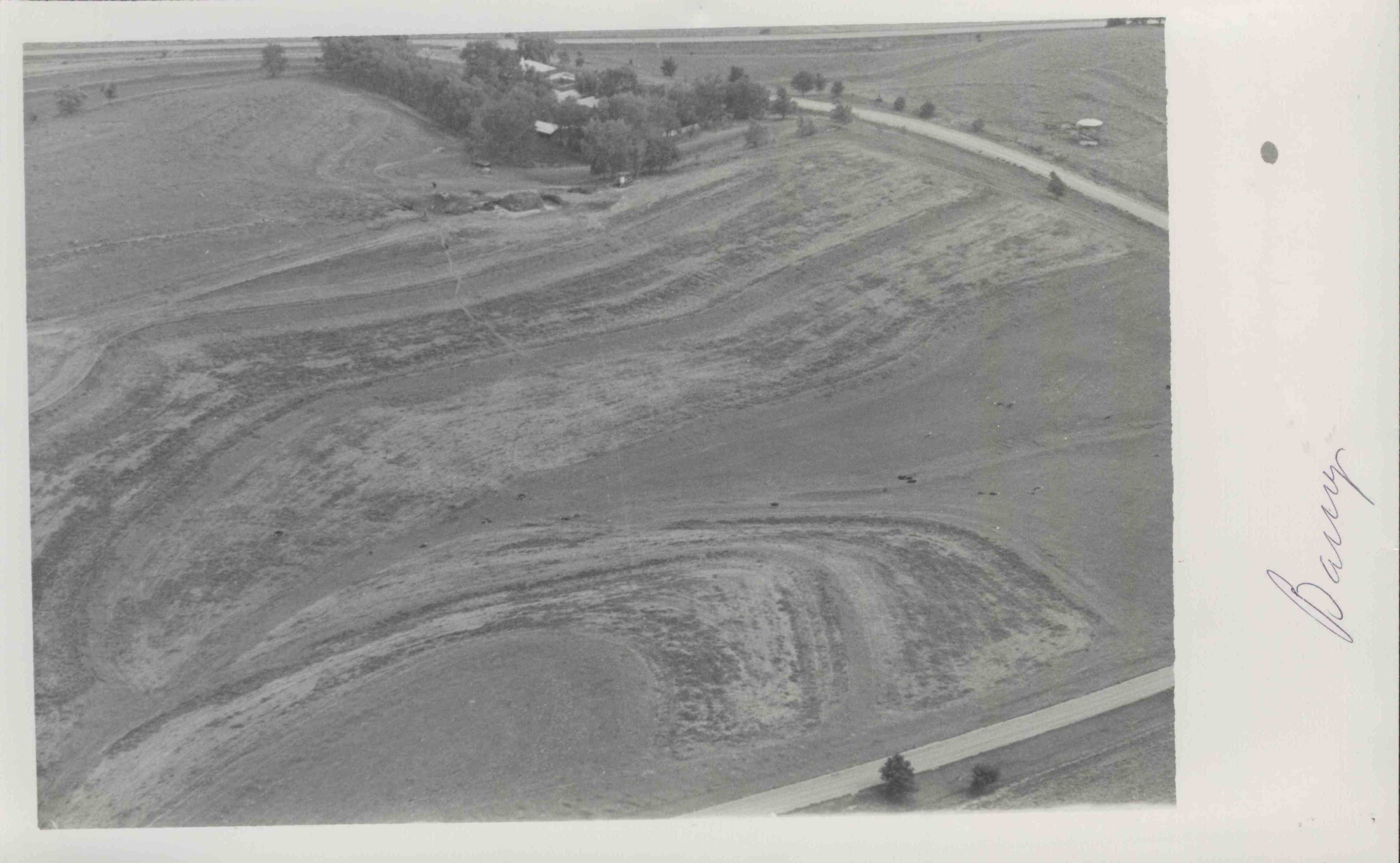 Contoured farm with buildings belongs to Mr. Barry