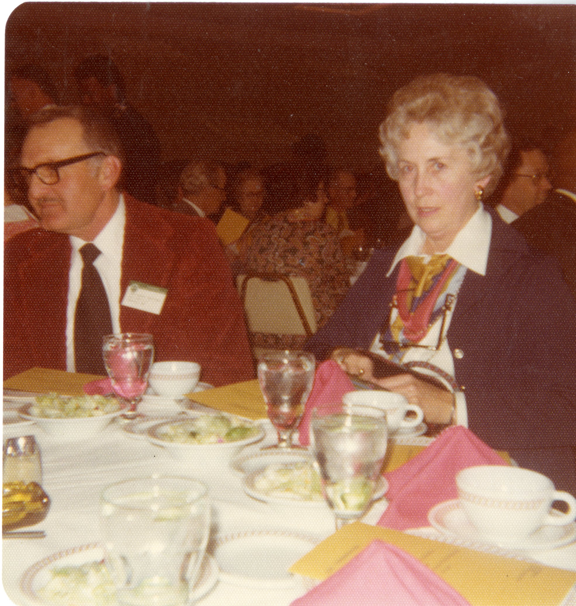 Mr. and Mrs. Robert Boatman sit at a conference dinner
