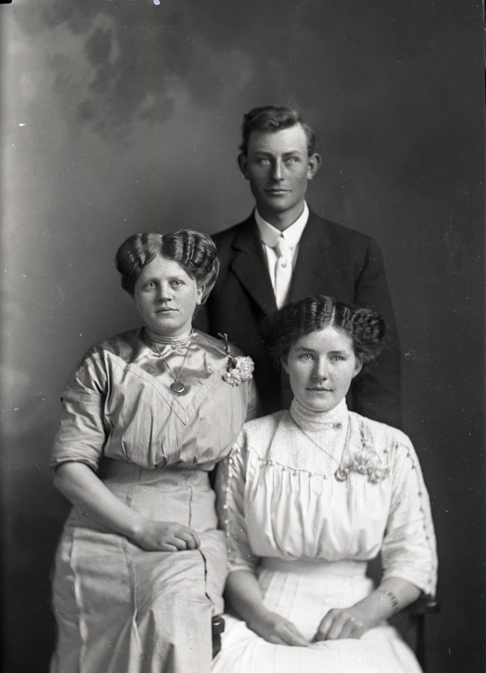 Man and two women