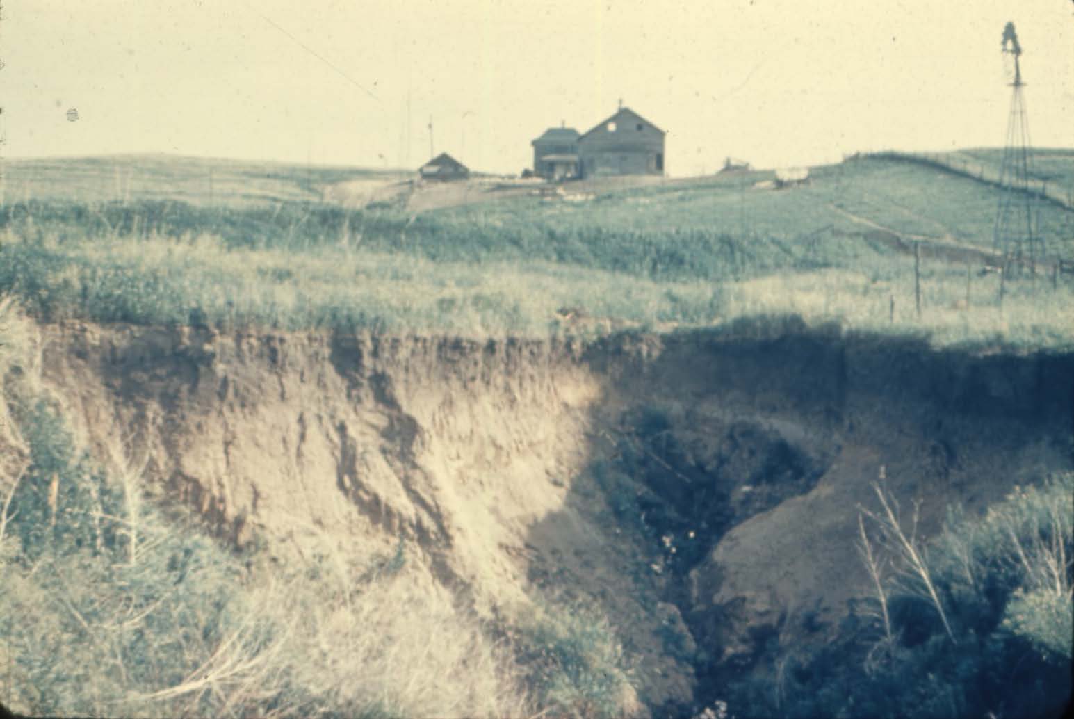 Large gully in front of barn 