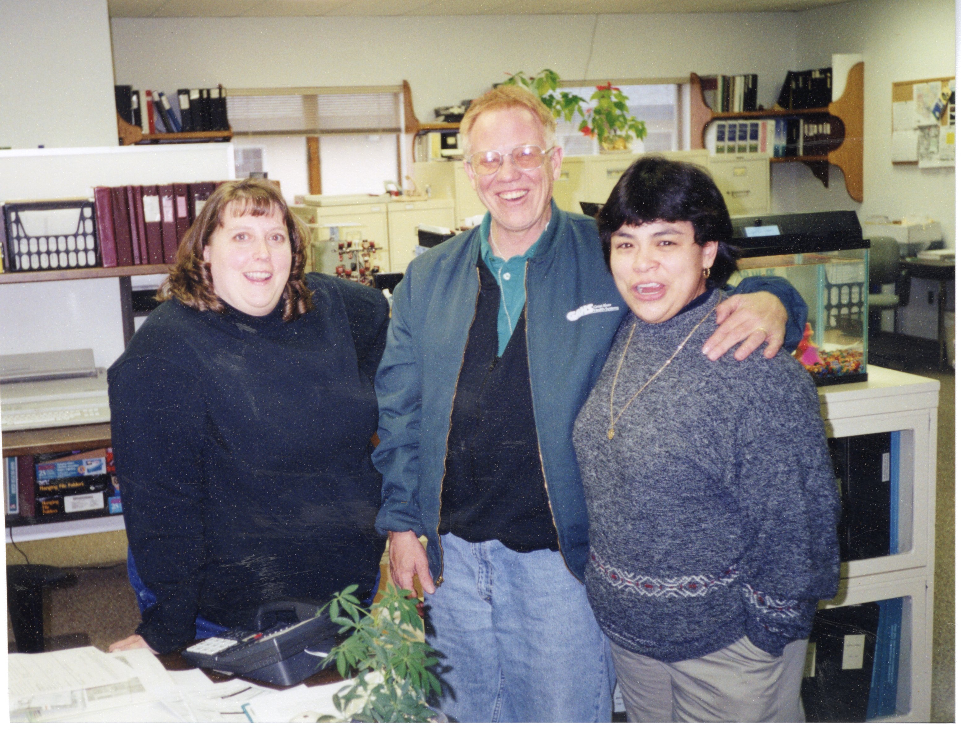 2001  Des Moines County Soil and Water Conservation  District Secretary Jamie Grimes, District Commissioner Ron Snyder, and NRCS District Conservationist in Wapello, Connie Ramirez pose for a photo