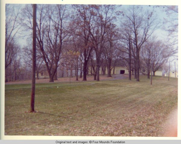 View of yellow houses and barn in Fall