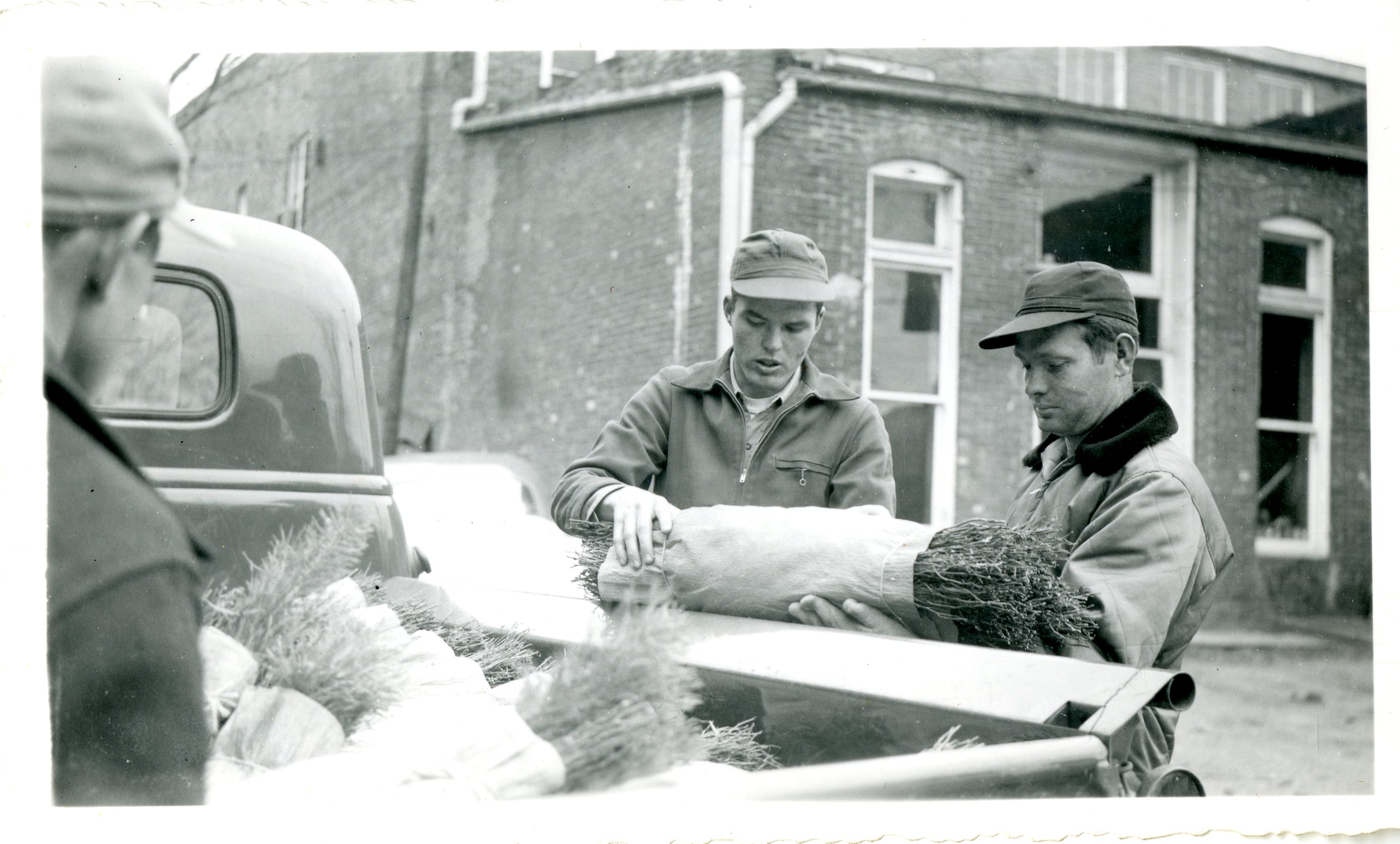 Three Men Loading a Truck