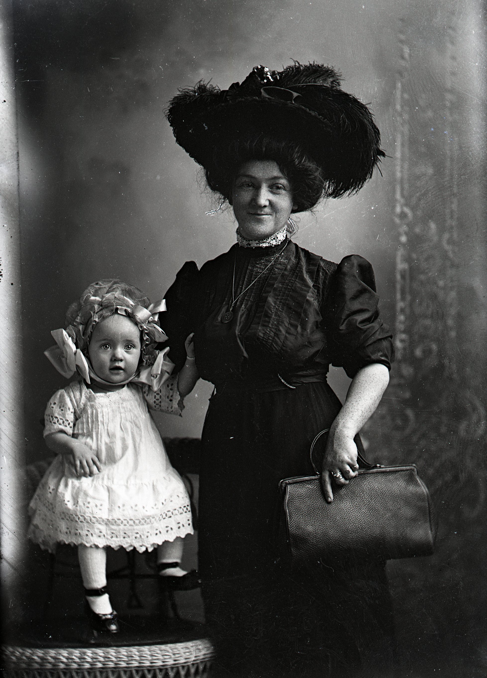 Woman and toddler girl in hat