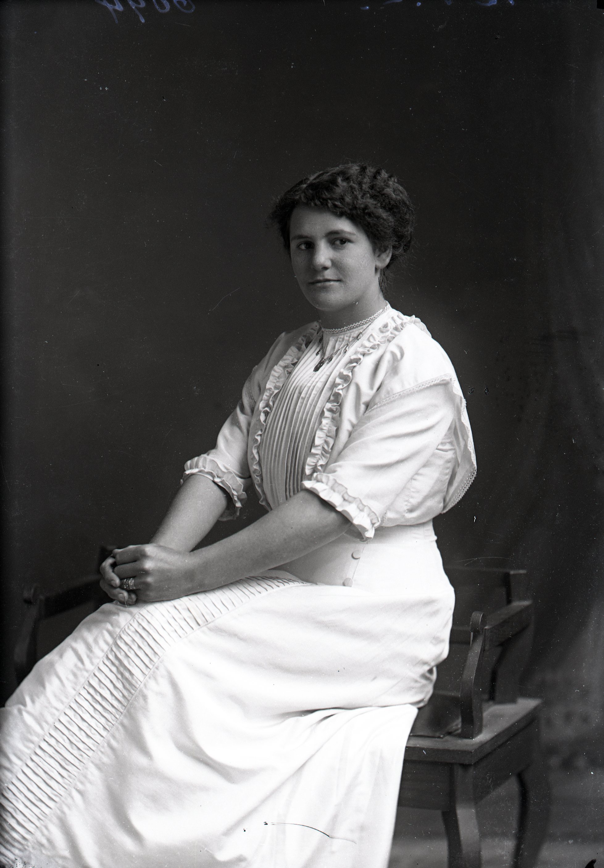 Woman, hands clasped