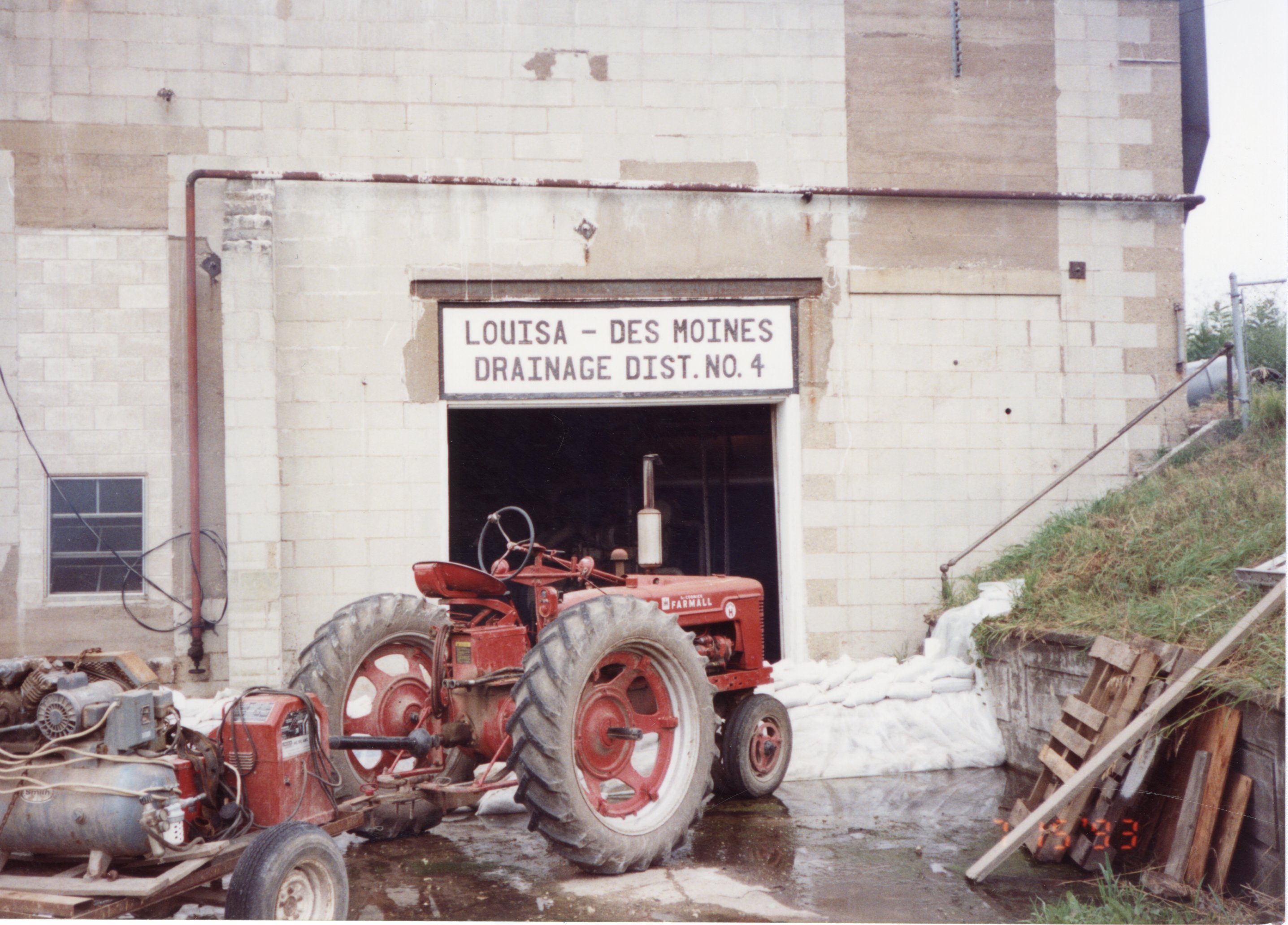 A tractor sits in front of Louisa-Des Moines County drainage ditch number 4