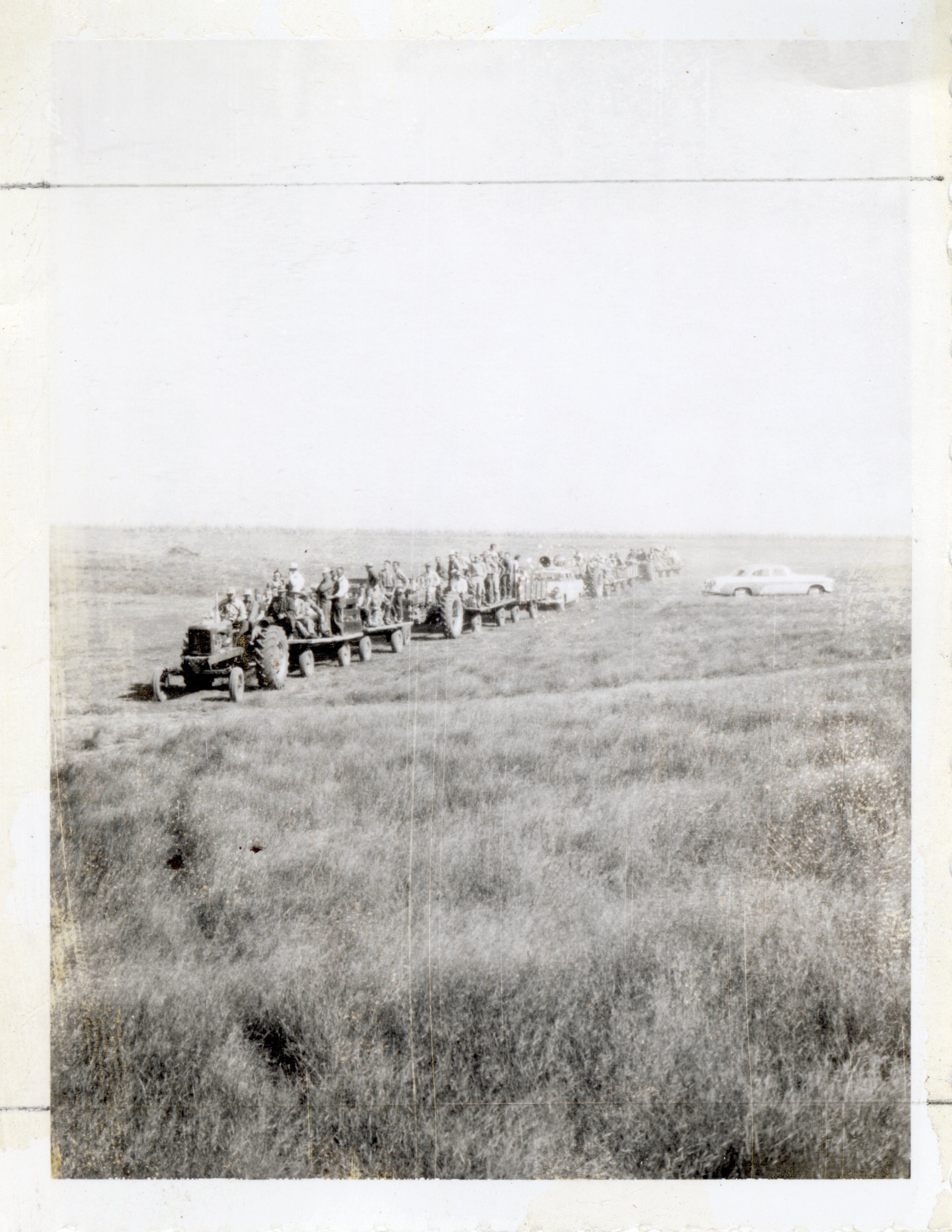 Tractors  Carry Men on Flatbed Trailers