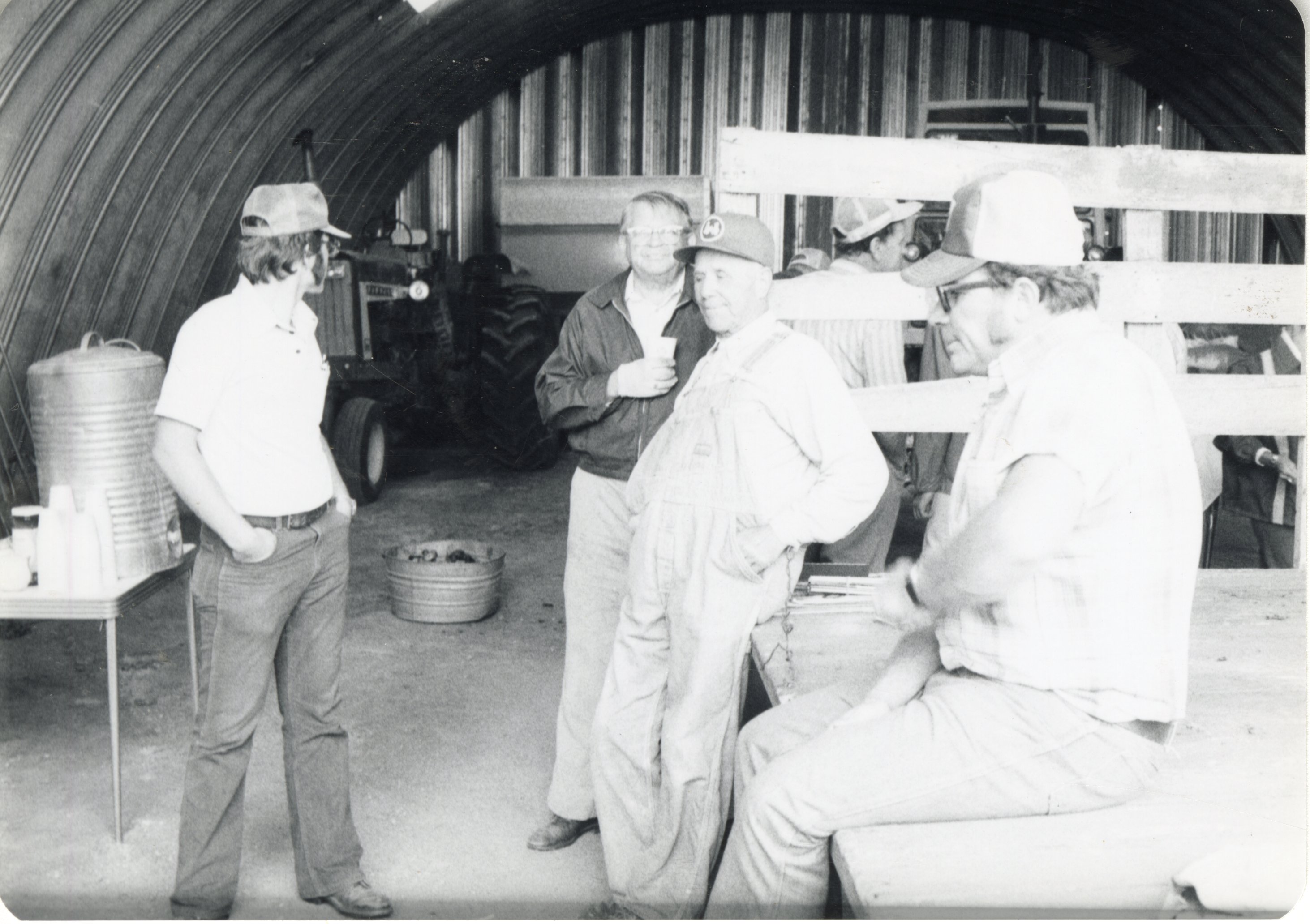 Six men in barn