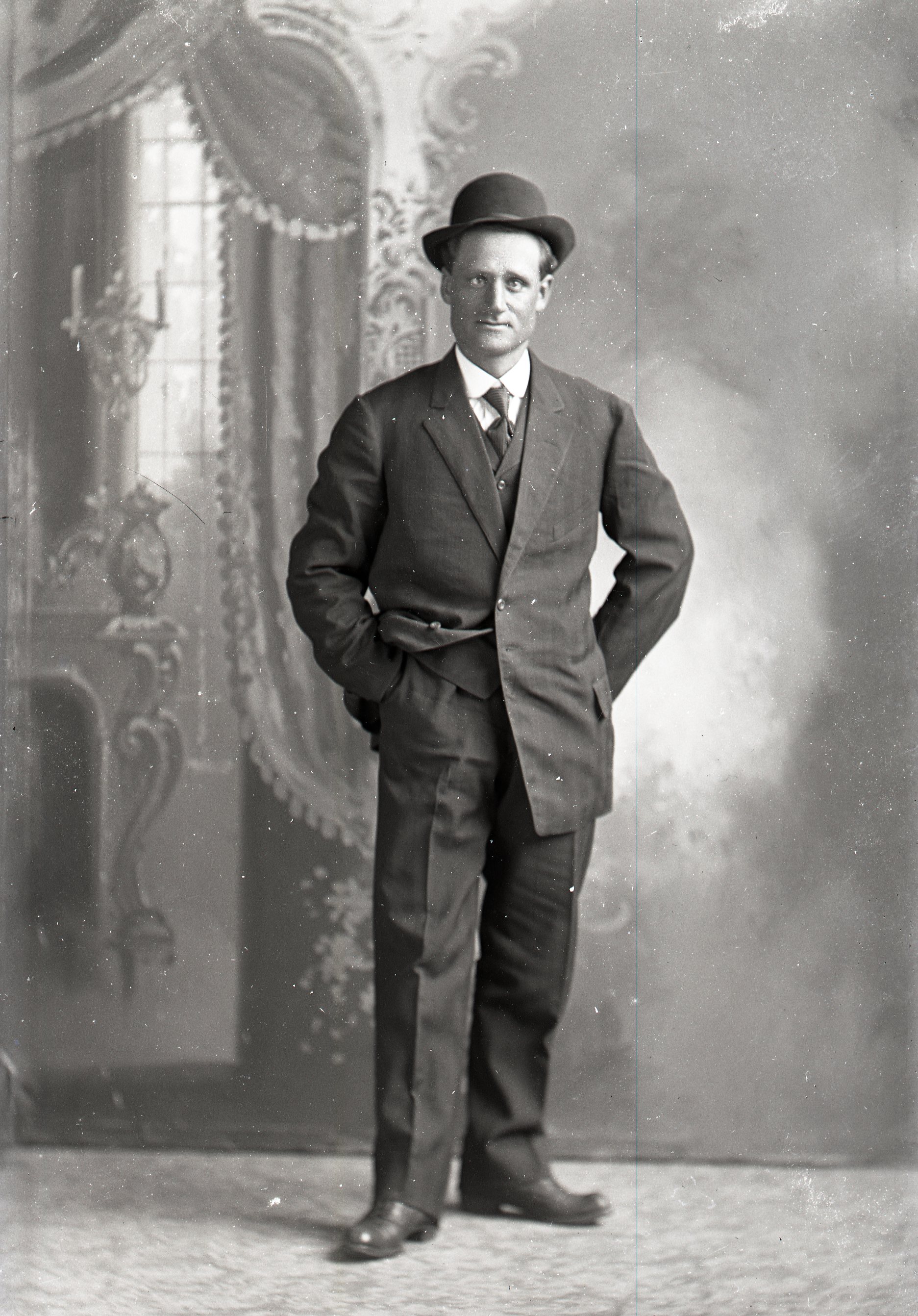 Man standing with hat