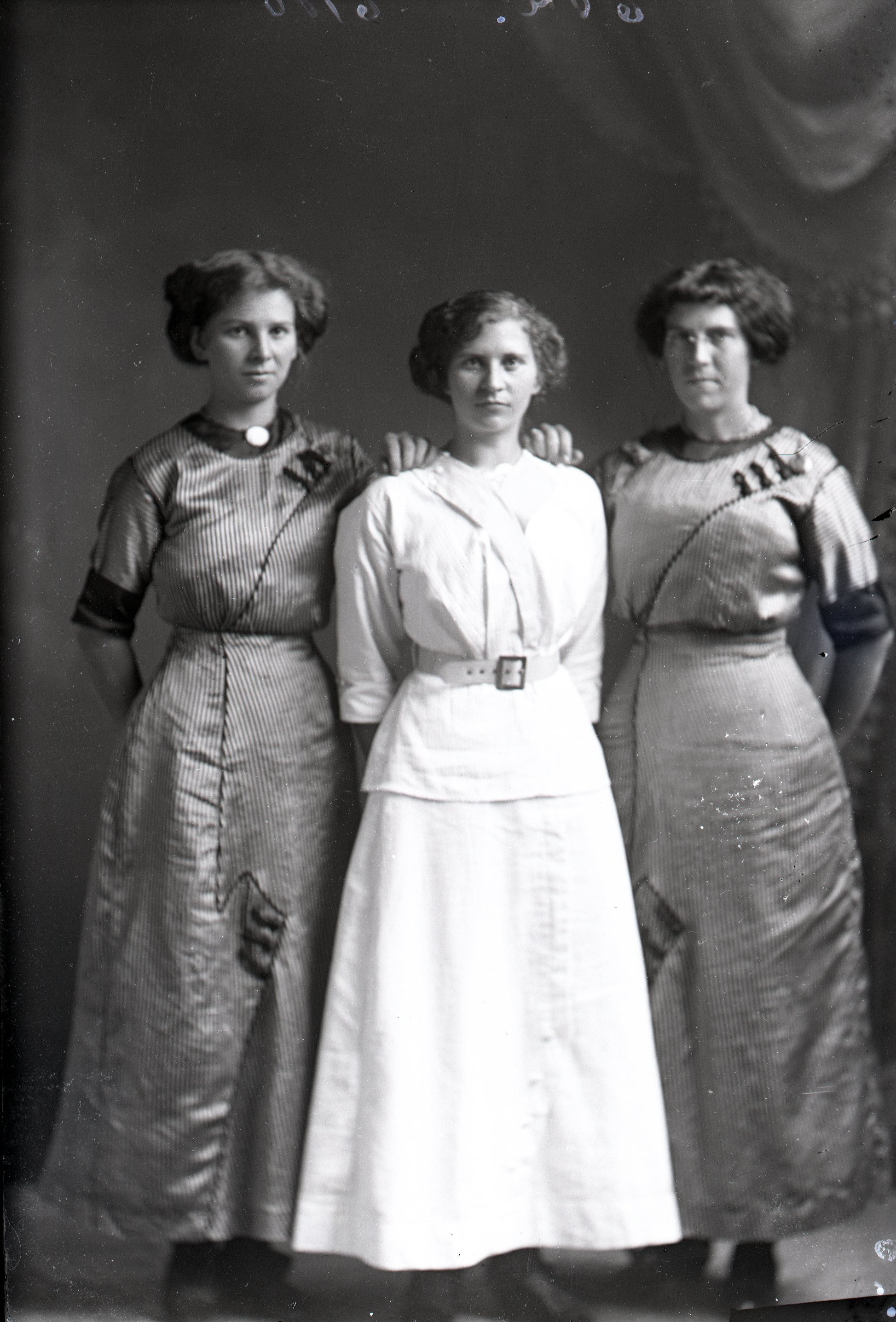 Three women standing