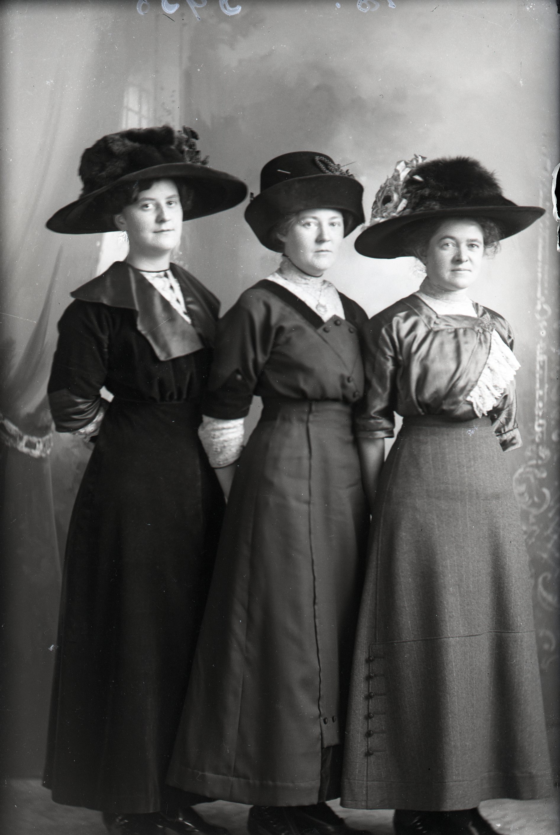 Three women in hats