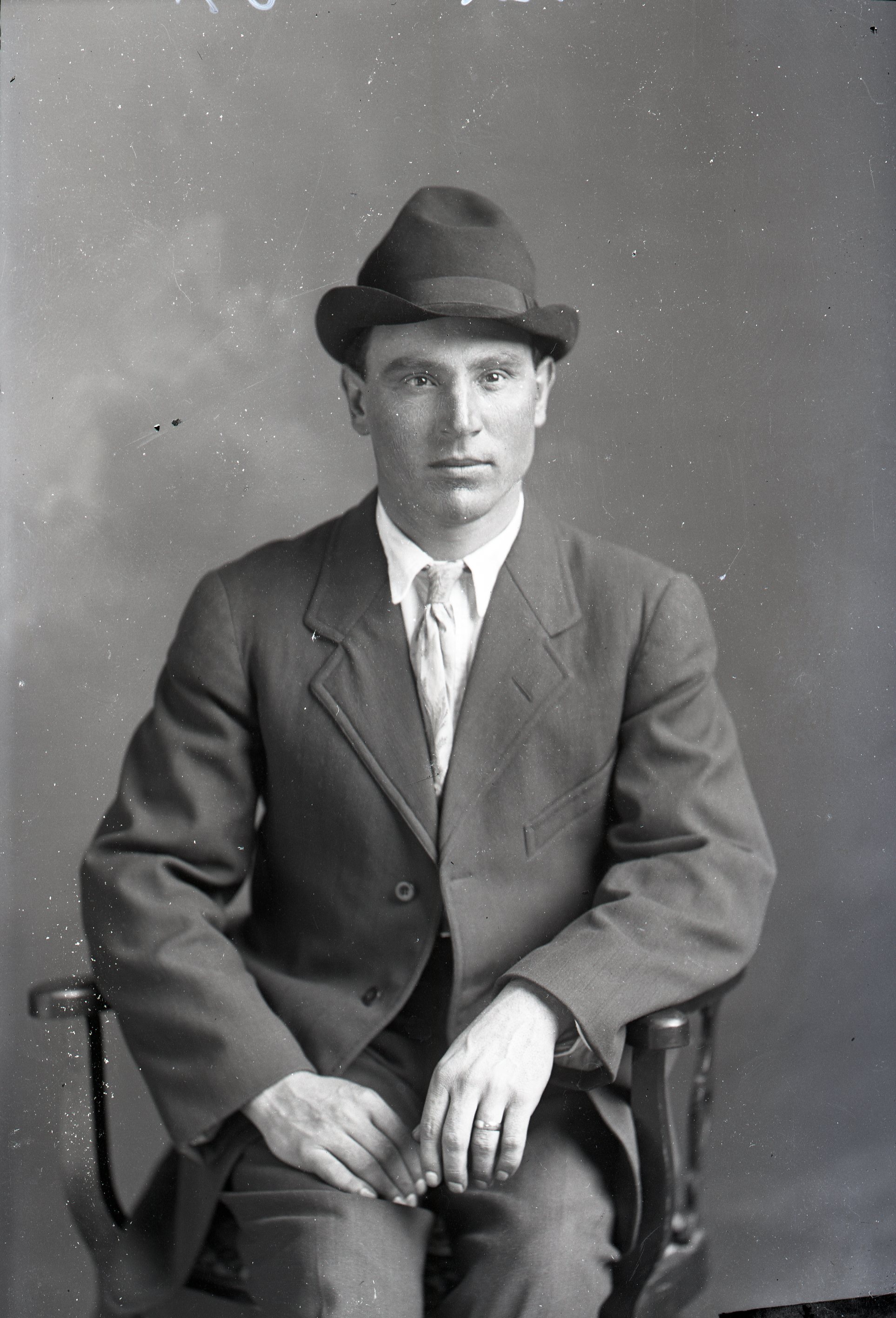 Man with hat, seated