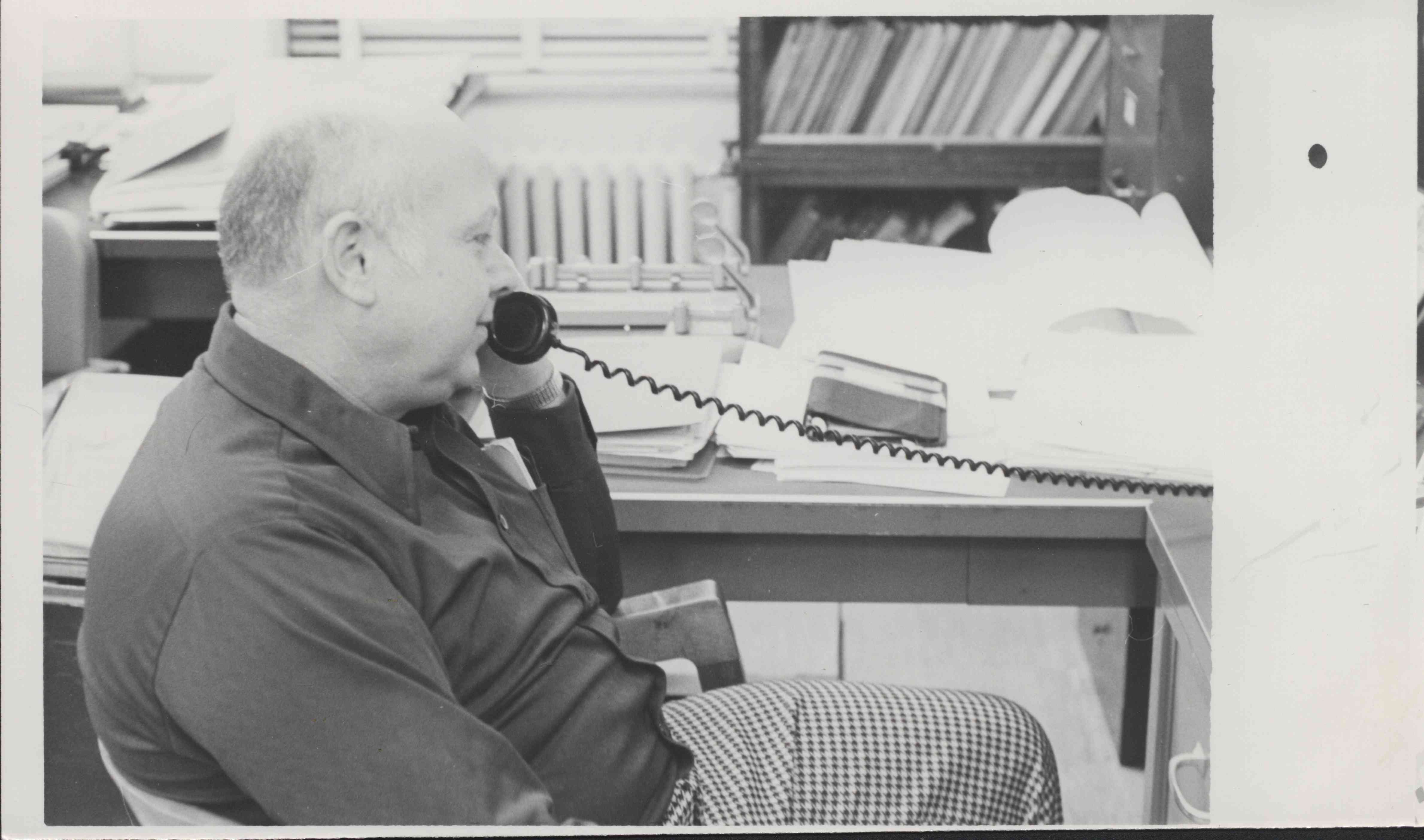 Unidentified Seated Man Talking on Telephone