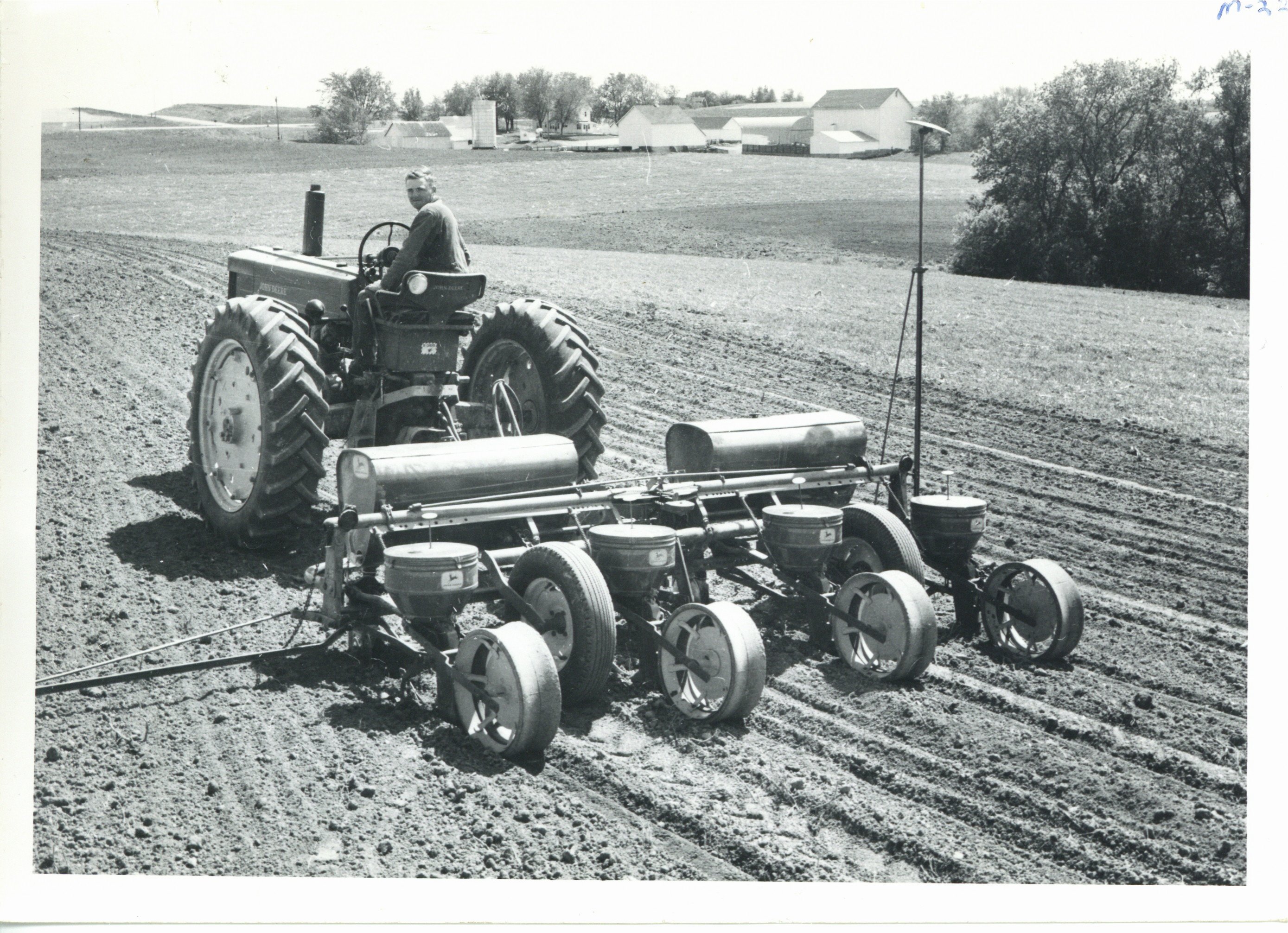 Melvin Manders on tractor, 1964