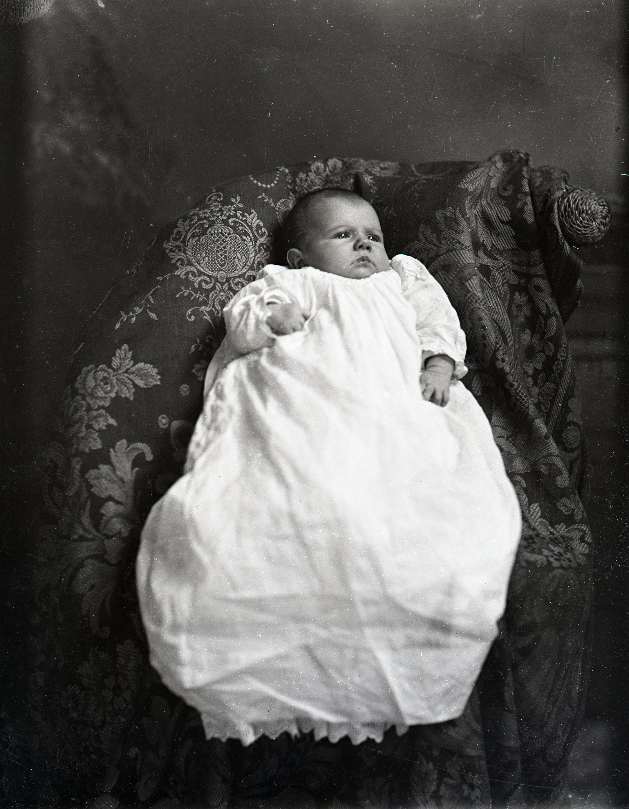 Infant in white dress