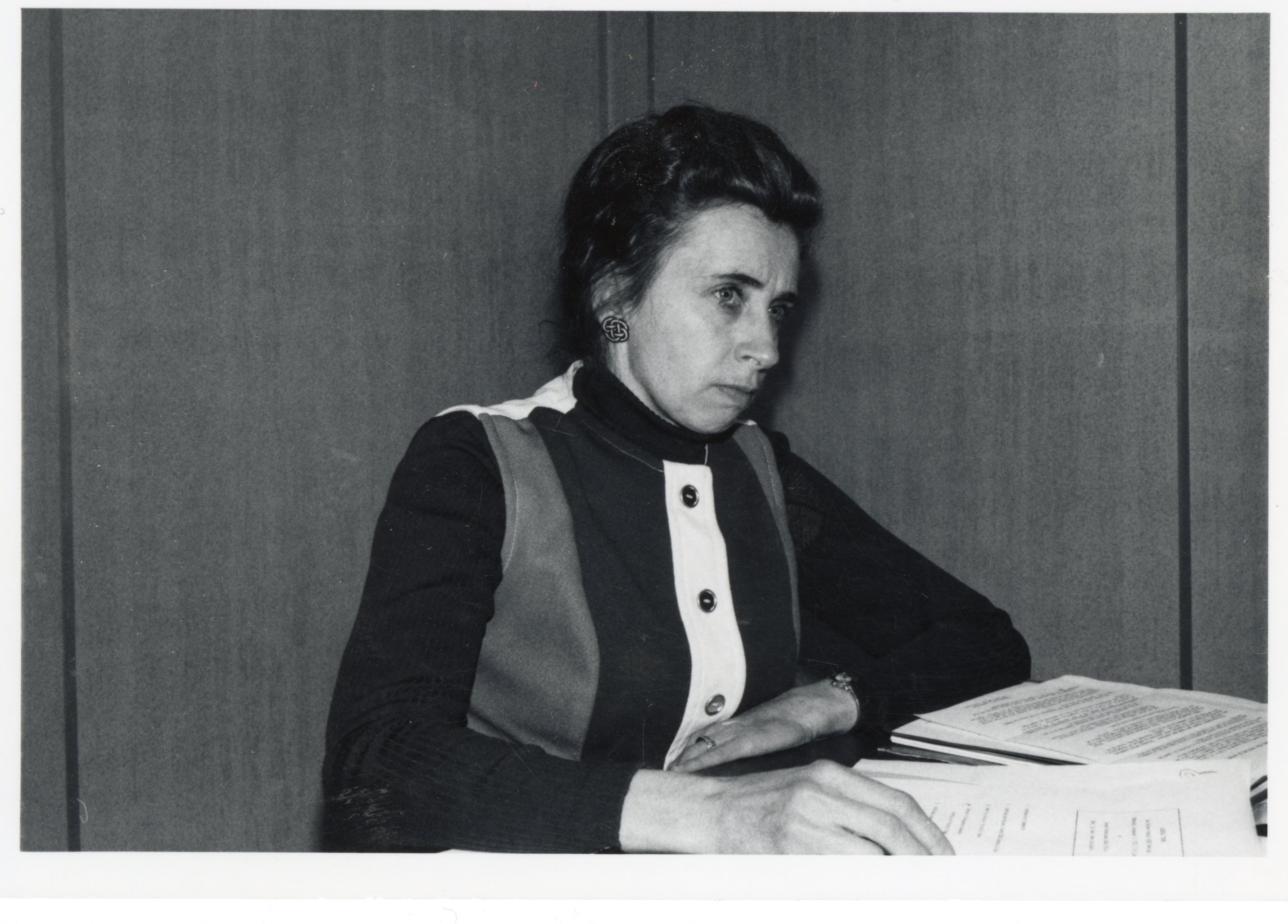 Unidentified woman reading papers