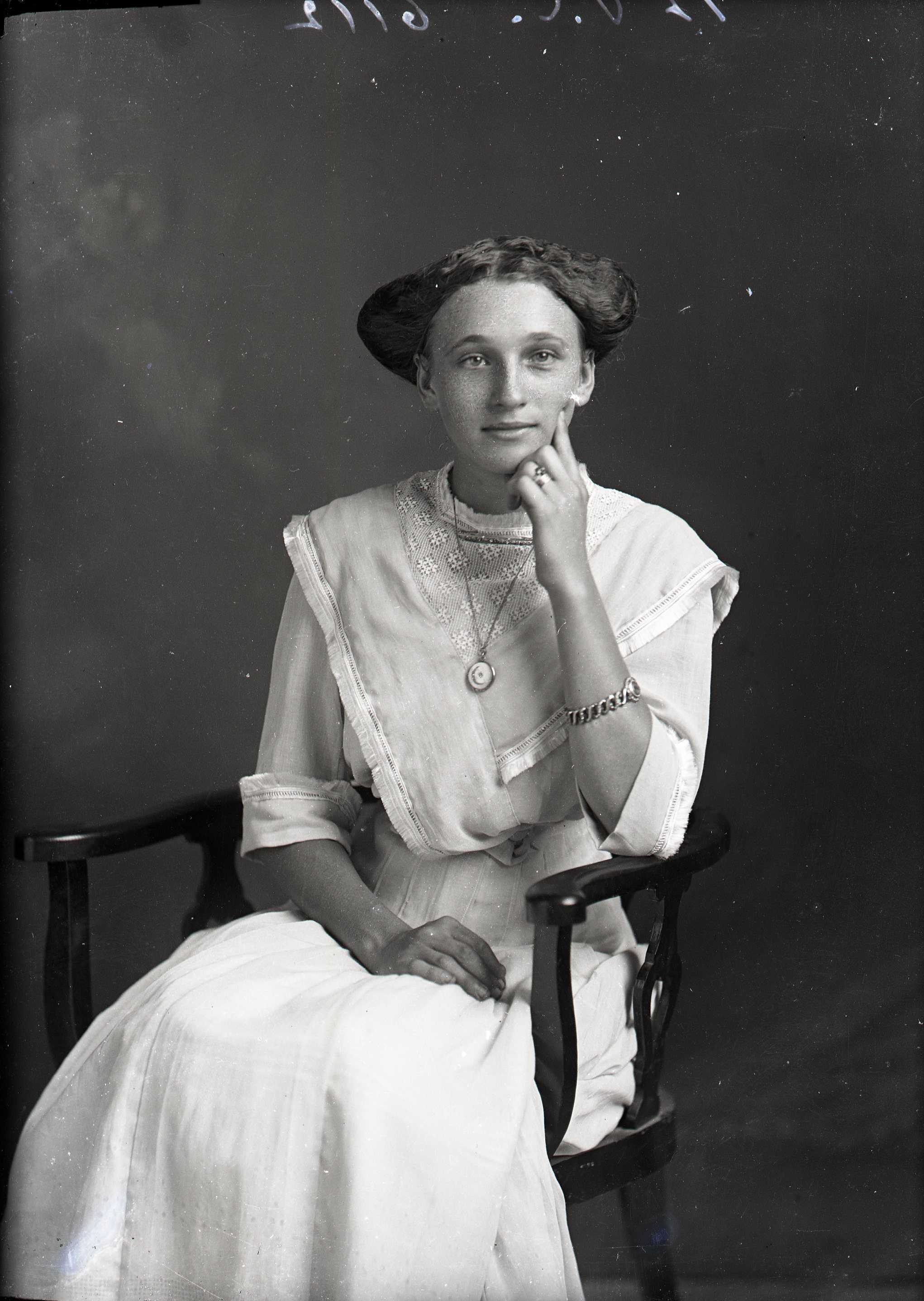 Woman seated in chair
