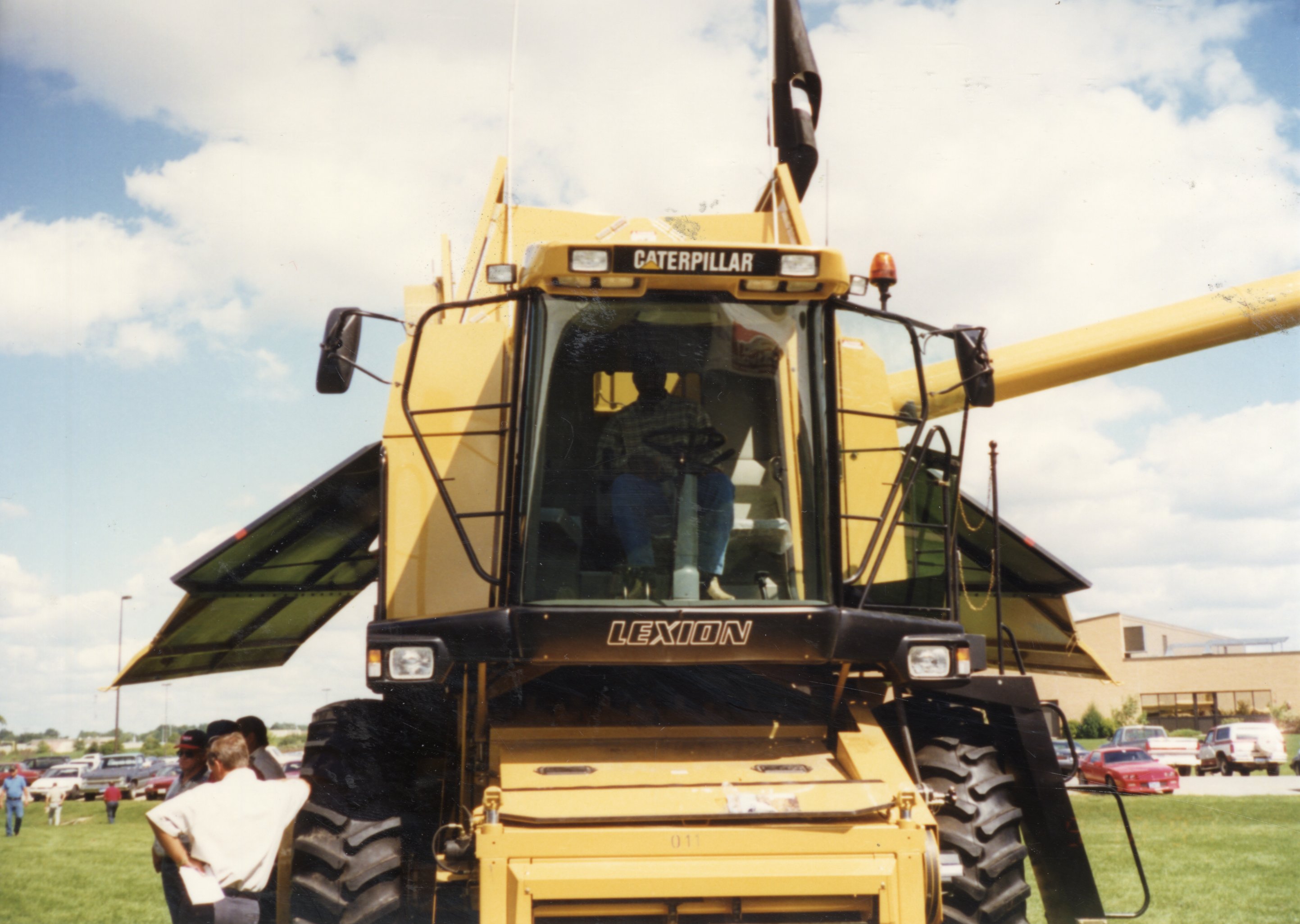 1997 District Conservationist J.B. Martin Sits in Caterpillar Combine at Ag Expo 1997