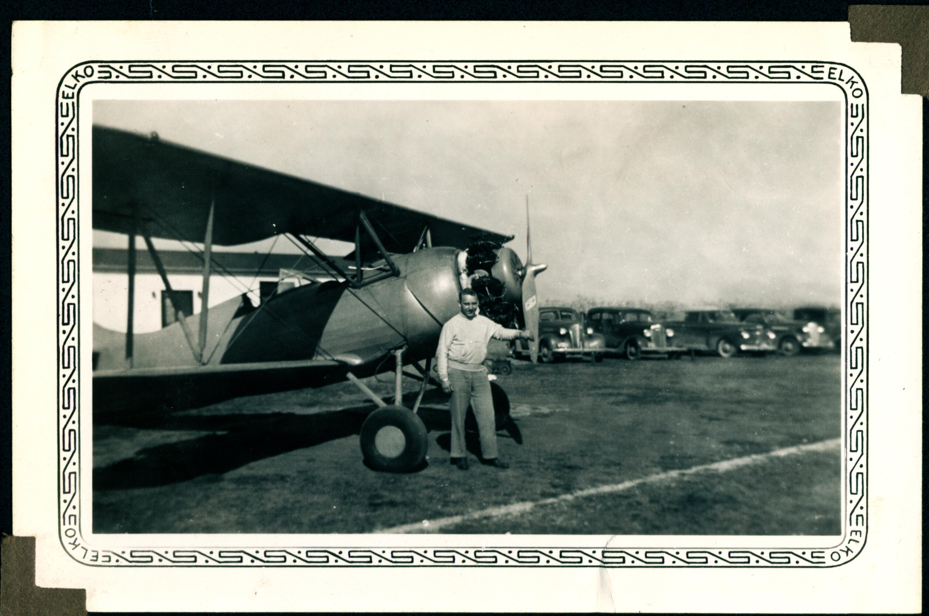 0049_Earl Pohlmann in Front of Plane, 1942