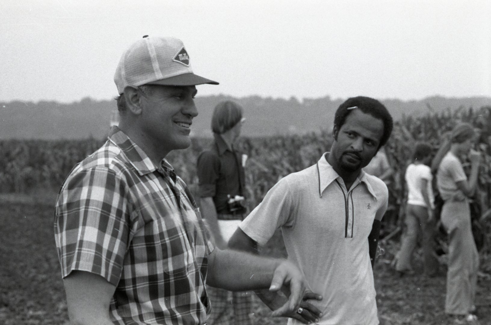 1978  William Baugh talks with John Wagenbach and other farmers in field during no-till corn field tour