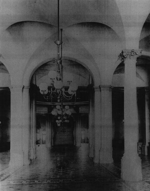 First floor corridor and Grand Staircase viewed through the main entrance, circa 1885.