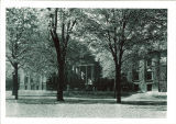 Eastern facade of Hall of Liberal Arts (now Schaeffer Hall) partially obscured by trees, The University of Iowa, 1910