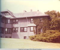 Rear view of Grey house with ivy