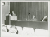 Earl O. Heady speaking before a group in Hungary, viewed from the right, 1979