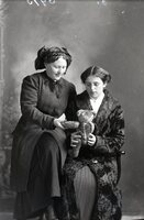 Two women with teddy bear