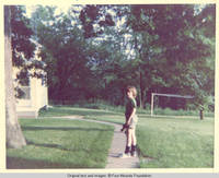 John, Jr. on sidewalk to Gardner's house