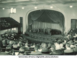Group of people on stage at Macbride Hall for Founder's Day, The University of Iowa, 1940s