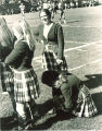 University of Iowa Scottish Highlanders dancers on sidelines of football game, 1969 or 1970