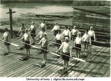 Marjory Camp students doing a canoeing land drill, The University of Iowa, 1930s