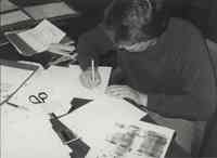 Office Photo of Man Sitting at Desk Writing