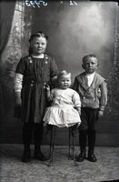 Three children (girl, boy, infant)