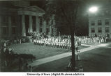 Nighttime ceremony and rally in front of the Old Capitol, The University of Iowa, 1920s