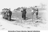 Governor N.E. Kendall saluting cadets on Iowa Field, The University of Iowa, June 4, 1921
