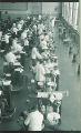 Dental students with patients in the infirmary clinic, The University of Iowa, 1940s