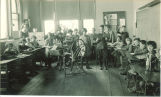 Classroom spinning and weaving demonstration, The University of Iowa elementary school, 1920s