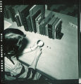 Woman with Bollinger-Lincoln books in Special Collections Dept., The University of Iowa, 1951