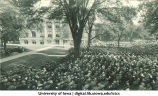 Crowd gathered for Commencement on the Pentacrest with Macbride Hall in background, The University of Iowa, June 1926