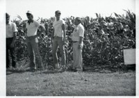 Group of Men in Corn Field