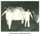 Waiters carrying cake at Centennial Dinner, Iowa Memorial Union, University of Iowa, February 25, 1947