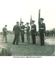 Man shaking hands with the color guard, The University of Iowa, 1950s